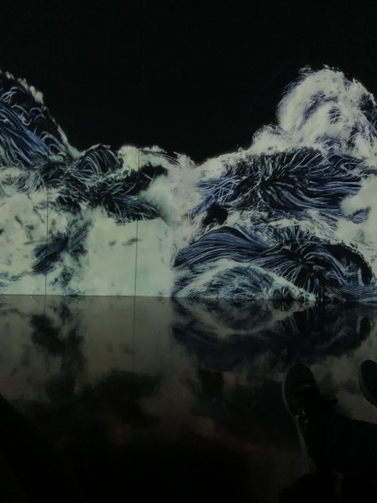 A photograph of a wave room in the interactive museum TeamLab Borderless in Tokyo, Japan. Photographed by Rebecca Newnham.