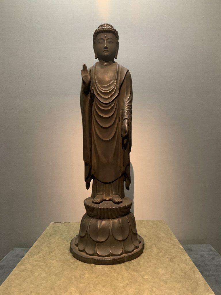 A photograph of a statue of a Buddha in the Tokyo National Museum in Japan. Photographed by Rebecca Newnham.