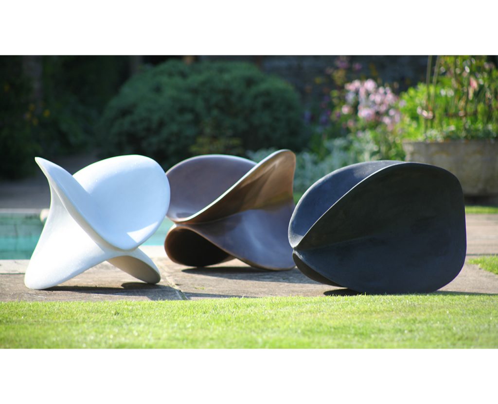 A collection of three cast sculptures called Soar by Rebecca Newnham in Bronze, white imploded glass concrete, and black imploded glass concrete. Photographed by David Bird.